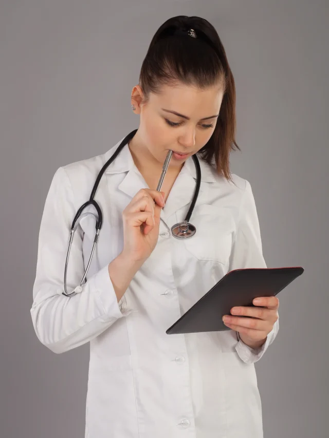 nurse-is-thinking-about-something-against-grey-background